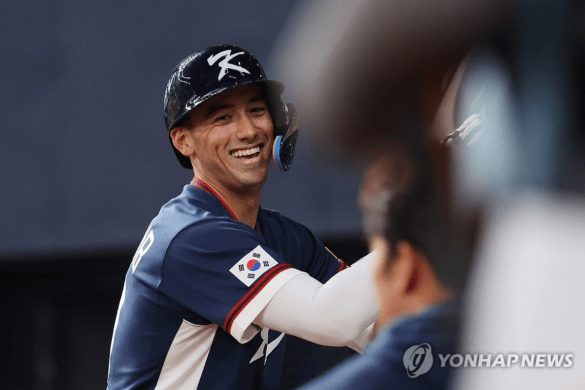 Korea's Shay Whitcomb celebrates at the WBC