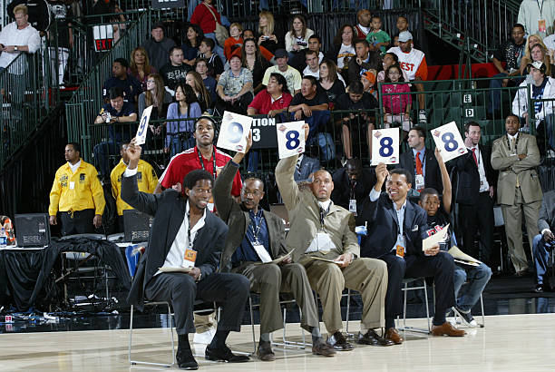 boxing judges hold up their scores